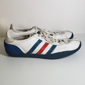 White, blue and red Daley Thompson. Size 12 US. Used but in great condition.